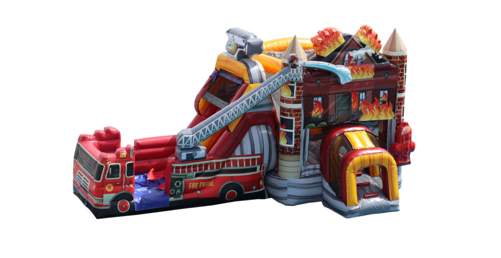 A massive inflatable holiday event setup featuring both a realistic red firetruck bounce house and a matching fire house inflatable with a slide, professionaly installed for a community event in Central Ohio.