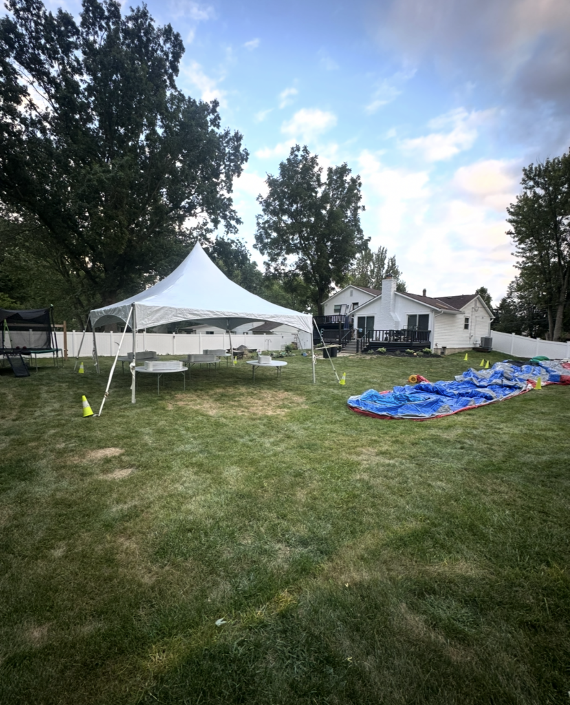 High-peak party tent setup in a Columbus OH backyard by BounceUp Ohio